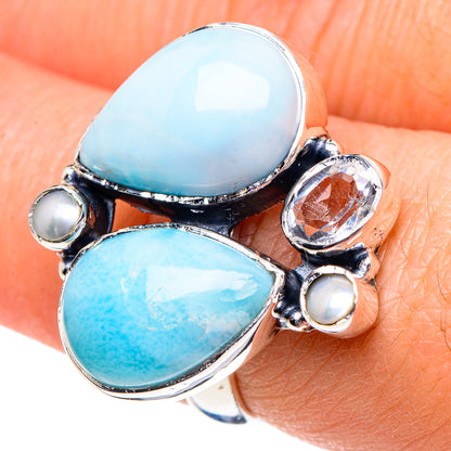 Sterling silver ring with two oval blue stones and pearl bead accents