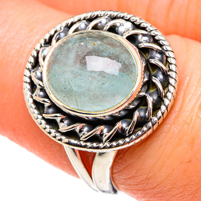 Sterling silver aquamarine ring with oval aquamarine cabochon and detailed halo setting