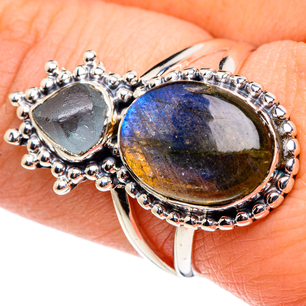 Sterling silver ring with two oval iridescent stones in blue and dark gray bezels