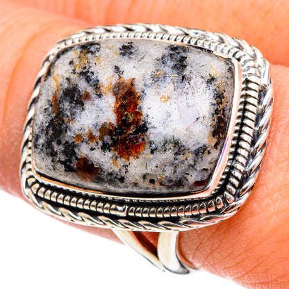 Sterling silver ring with astrophyllite stone, twisted rope frame bezel