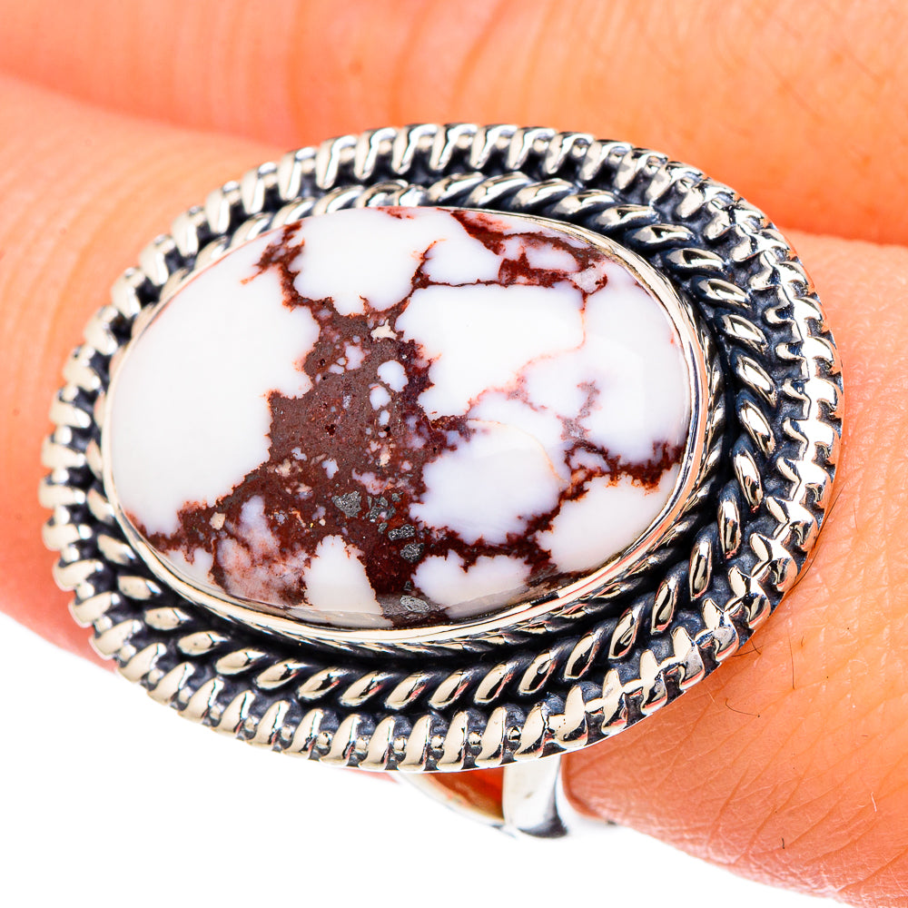 Wild horse jasper oval ring, detailed silver rope bezel; close-up on finger