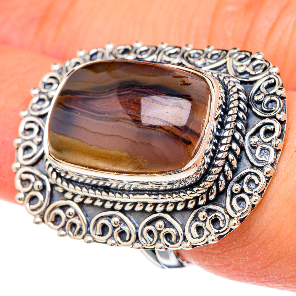 Oval Montana agate ring with ornate 925 sterling silver filigree bezel, dark brown cabochon.