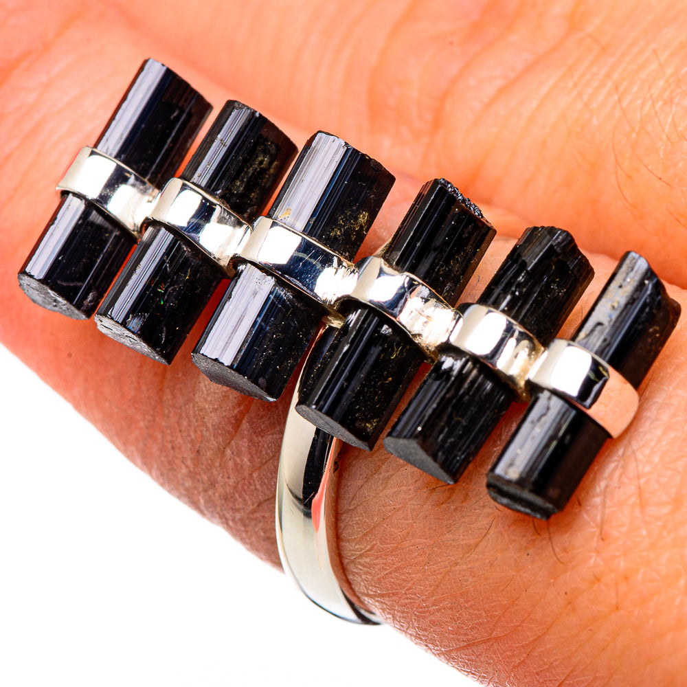 Black tourmaline bar ring with silver prong settings on wrist, size 7.25