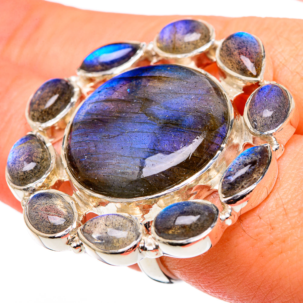 Sterling silver labradorite ring with oval blue-lavender center cabochon and small bezel stones