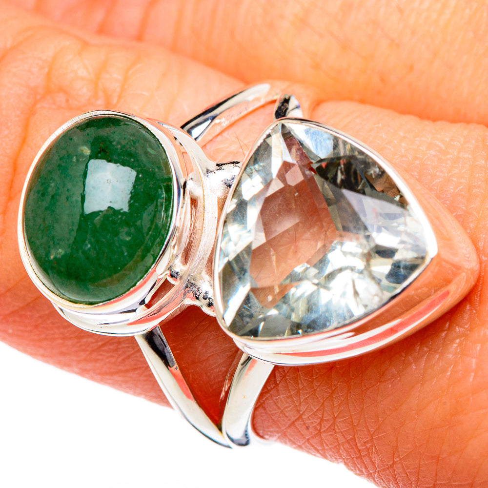 Sterling silver ring with green oval gemstone and large clear faceted stone on finger