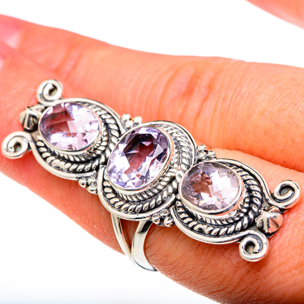 Sterling silver kunzite ring close-up with three oval faceted pink-lavender stones