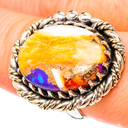 Oval orange cabochon ring with white patches, purple inlay, twisted rope silver bezel