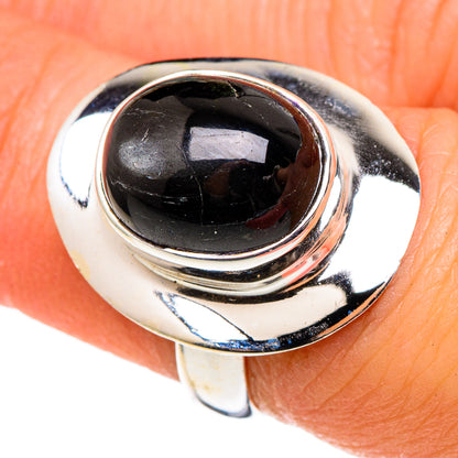 Sterling silver ring with oval black gemstone set in rounded, polished bezel
