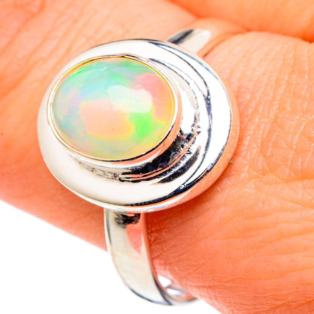 Sterling silver opal ring with round bezel-set iridescent Ethiopian opal