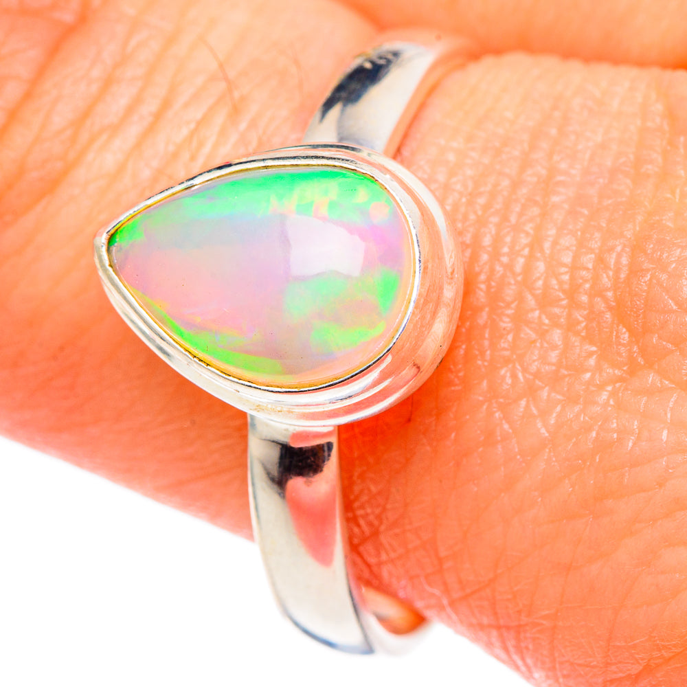 Natural opal teardrop ring with iridescent green and orange cabochon, 925 sterling silver