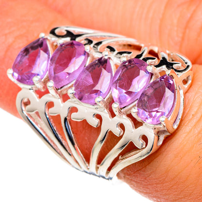 Purple alexandrite-style oval gemstone ring with three stones, silver filigree band