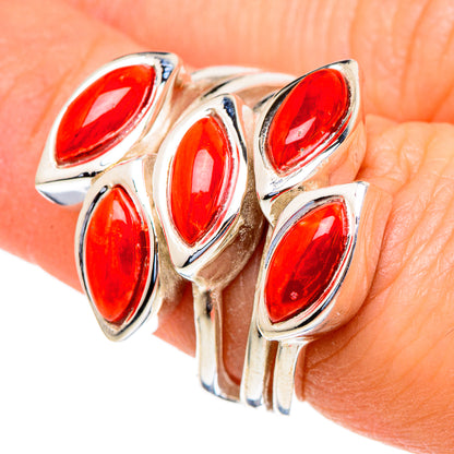 925 sterling silver coral red marquise stone ring on finger with multiple settings