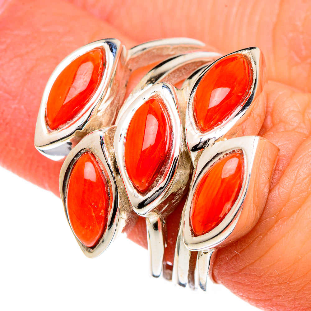 Sterling silver coral ring close-up with five marquise orange stones on bezels