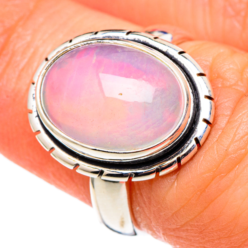 Sterling silver oval opal ring with black bezel and carved edge, pink iridescence