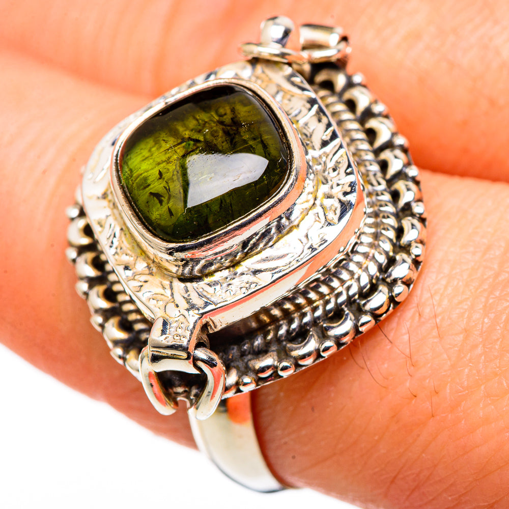 Sterling silver oval tourmaline ring with detailed twisted bezel and bright green center