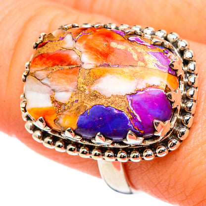 Oval opal-style cabochon ring with purple, orange, and gold tones; beaded silver band