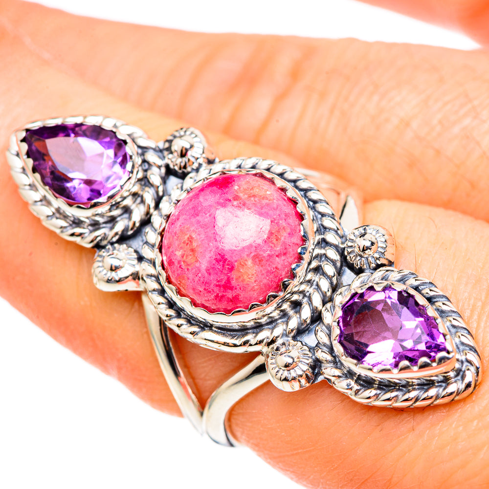 Silver ring with pink oval rhodochrosite center and two purple amethyst oval stones