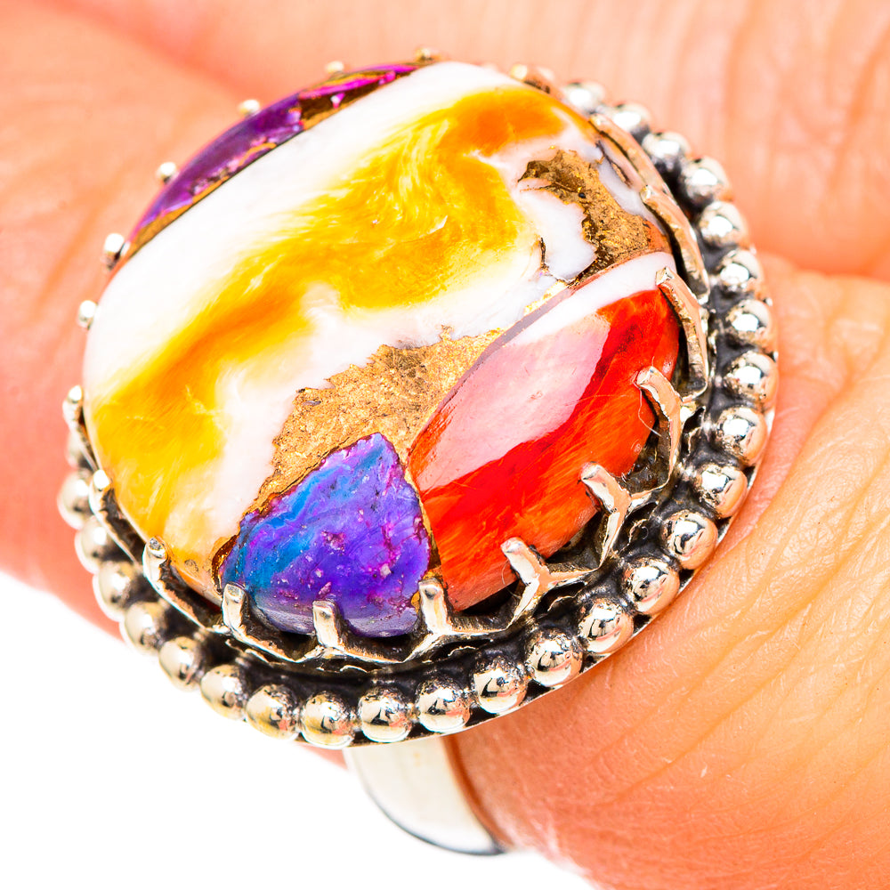 Sterling silver oval cabochon mosaic ring, close-up multicolor stones on hand