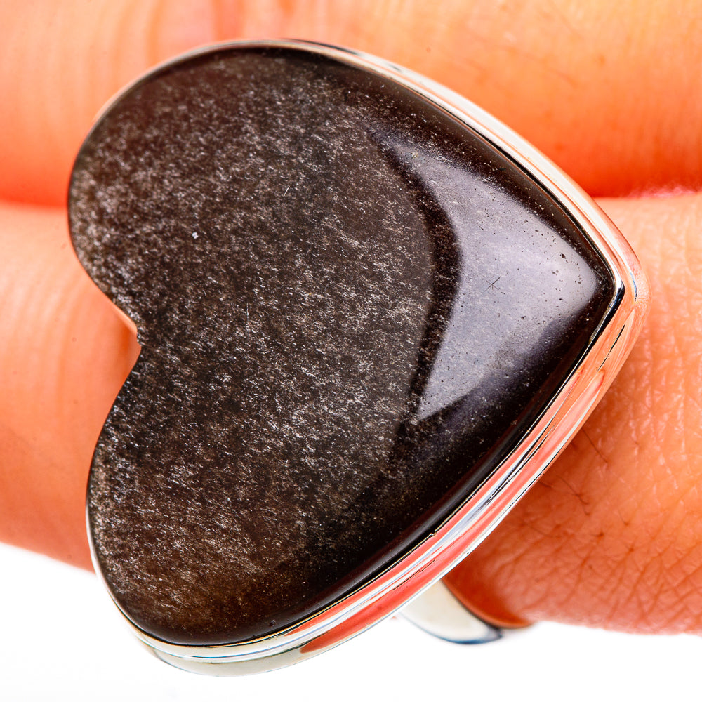 Heart-shaped smoky quartz ring close-up on dark stone in silver bezel, size 11