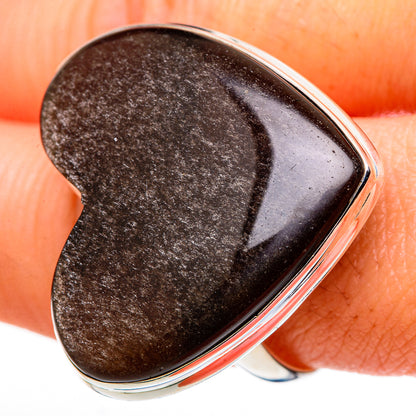 Heart-shaped smoky quartz ring close-up on dark stone in silver bezel, size 11