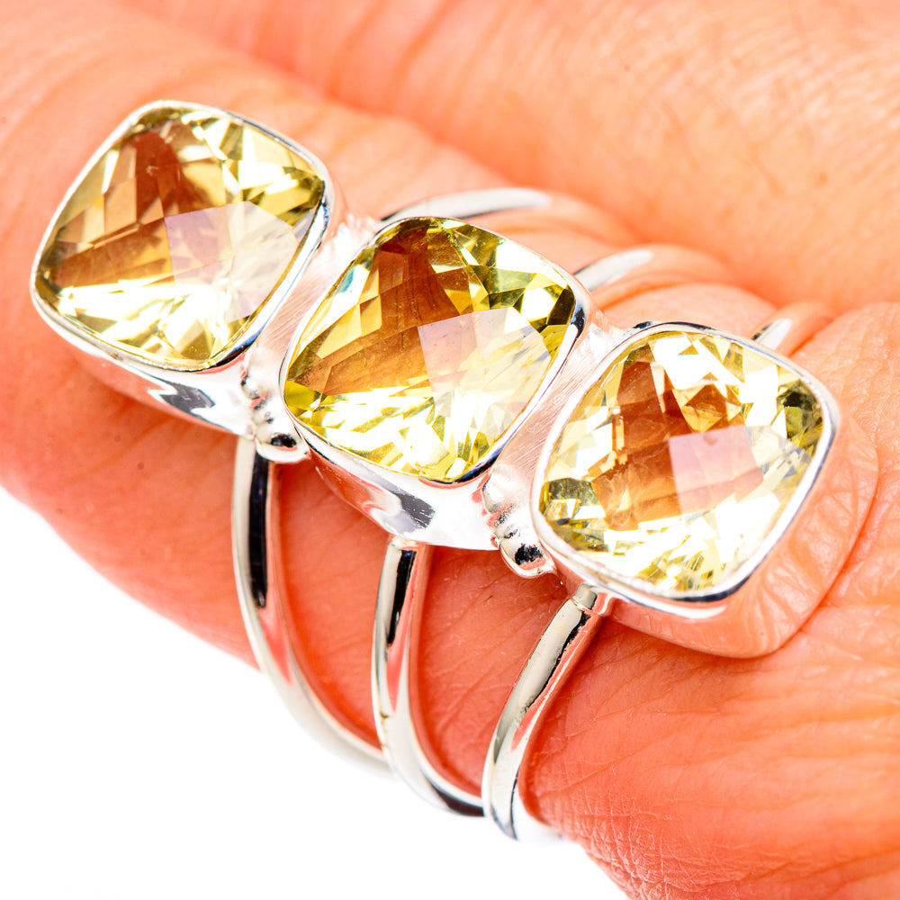 Sterling silver citrine ring with three faceted pear-cut stones in bezel settings