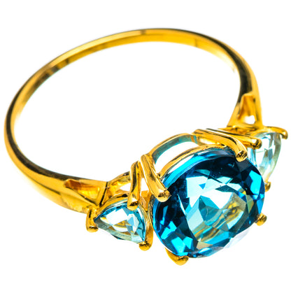 14K gold ring with large oval blue topaz center and two pear-cut side stones
