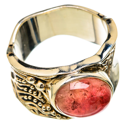 Polished silver-tone ring with oval pink tourmaline cabochon, ornate band with scrollwork