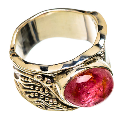 Silver-tone ring with oval pink tourmaline cabochon and ornate side details