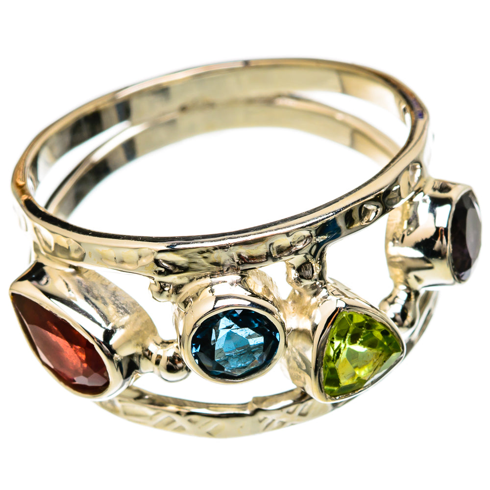 Sterling silver ring with blue center, green accents, red marquise, and dark stone