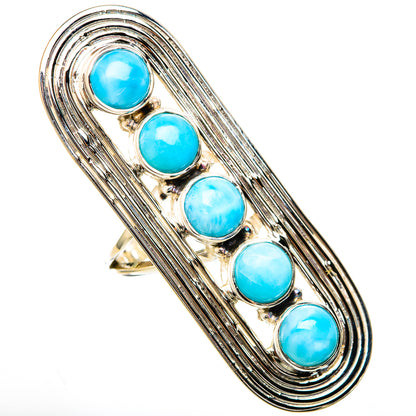 Silver gemstone ring featuring five blue larimar cabochons in a decorative frame