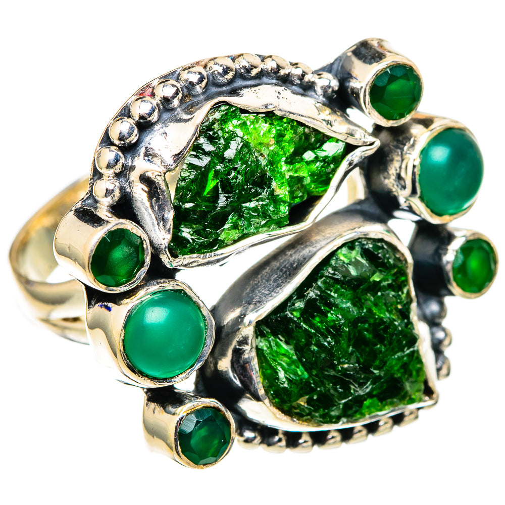 Green gemstone ring with rough crystal centerpiece and round green stones in silver setting