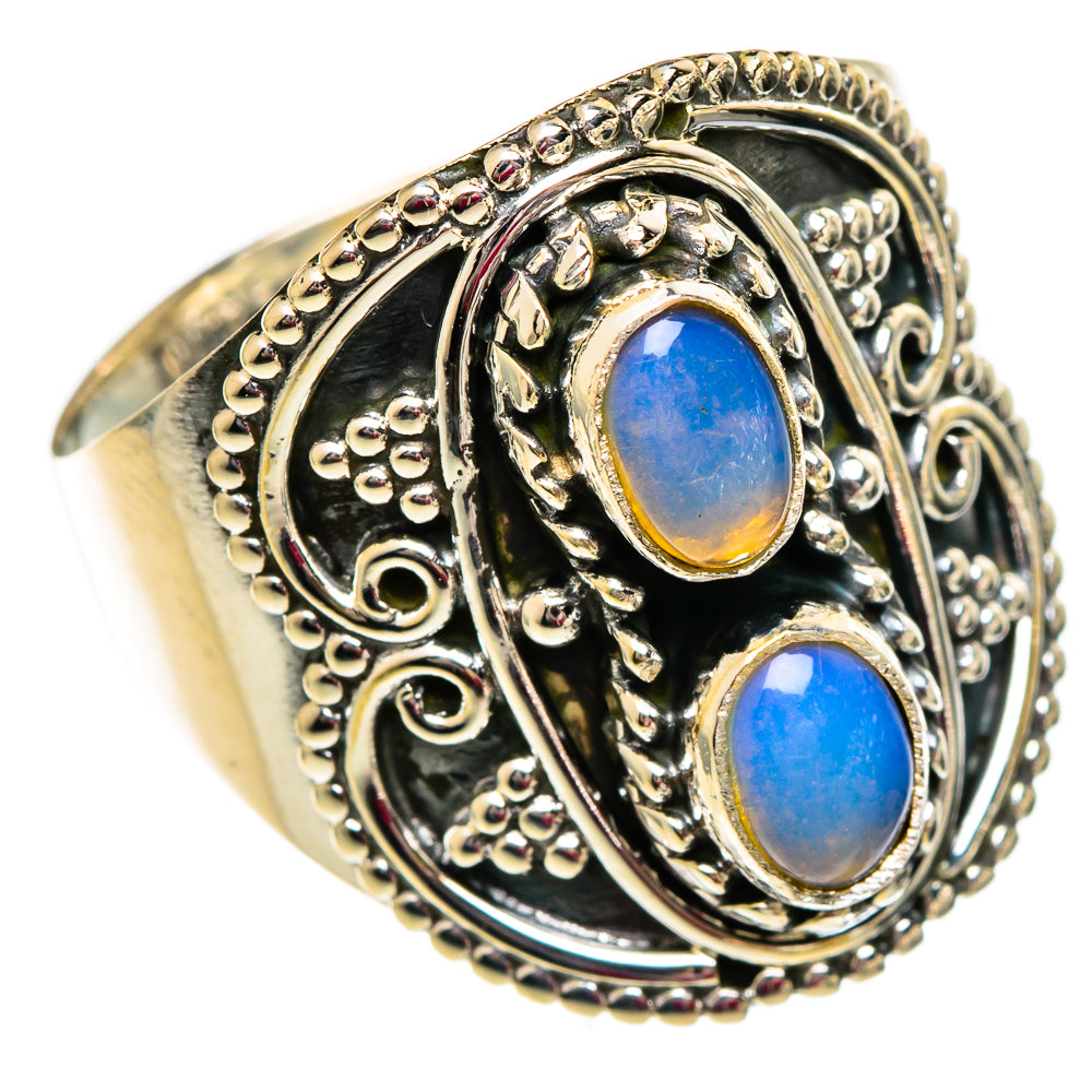 Sterling silver opal ring, side view, two blue oval stones in decorative raised frame