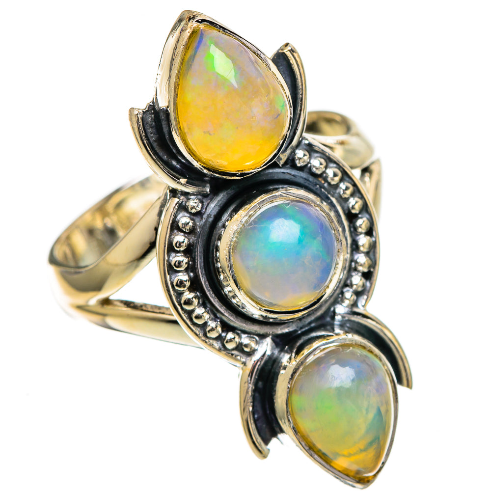 Sterling silver opal ring featuring three oval cabochons with dark bezels and bead borders