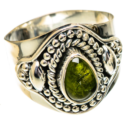 Sterling silver ring with oval green tourmaline and ornate beaded bezel, side view