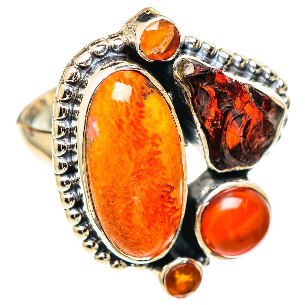 Sterling silver statement ring with oval orange cabochon, red round stone, and dark red side stone