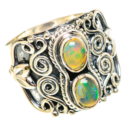 925 sterling silver ring with two oval opal stones and ornate scrollwork