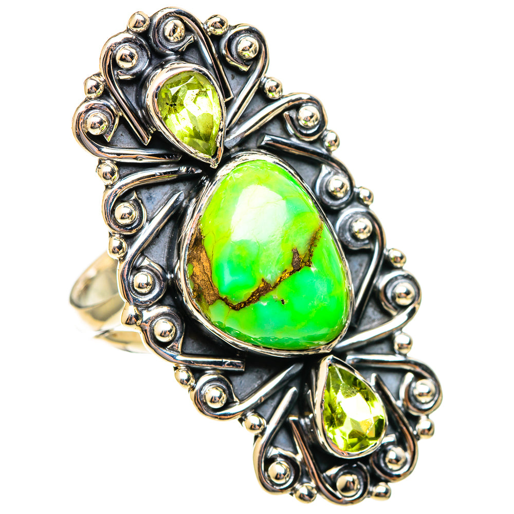 Green gemstone ring with large oval and teardrop stones in ornate silver setting