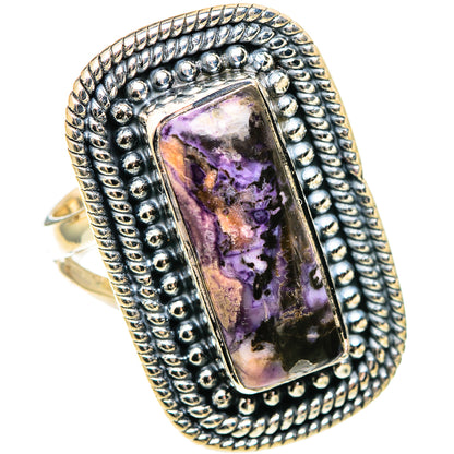 Sterling silver ring with rectangular purple stone and beaded halo bezel.