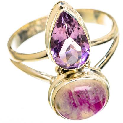 Gold-tone ring with purple teardrop amethyst and pink round moonstone cabochon