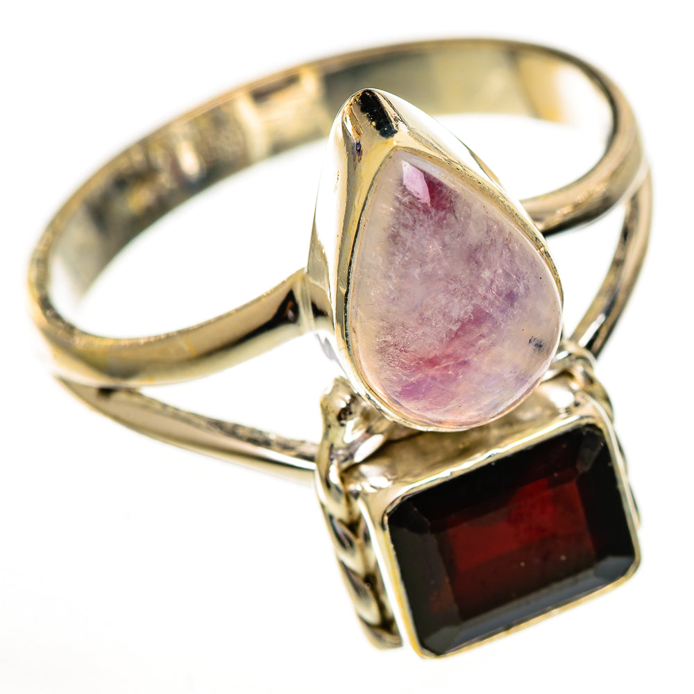 Silver-tone ring with oval pink moonstone and square dark red garnet centerpiece