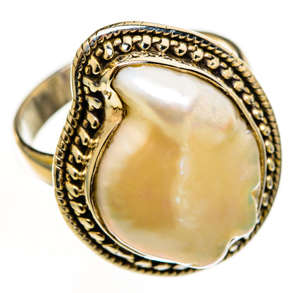 Mother-of-pearl sterling silver ring with oval cabochon and ornate beaded gold-tone bezel