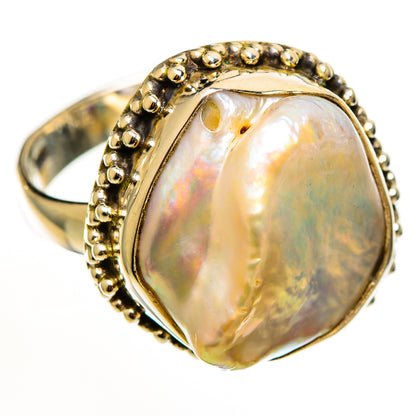 Sterling silver mother-of-pearl ring, beaded bezel with oval iridescent stone