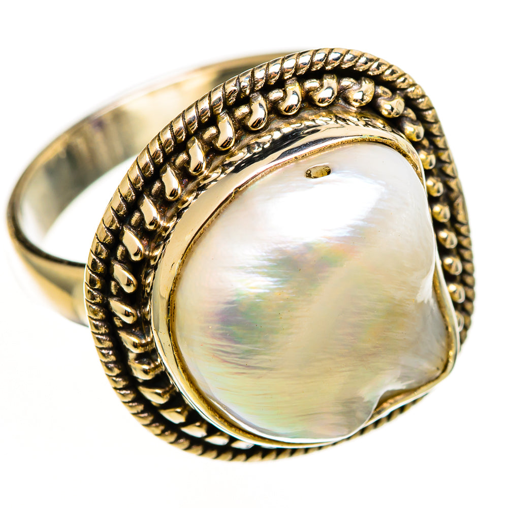 Mother-of-pearl teardrop ring with braided frame, rounded bezel, metallic band