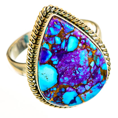 Teardrop turquoise inlay ring with purple-blue stone and ornate braided gold-tone bezel
