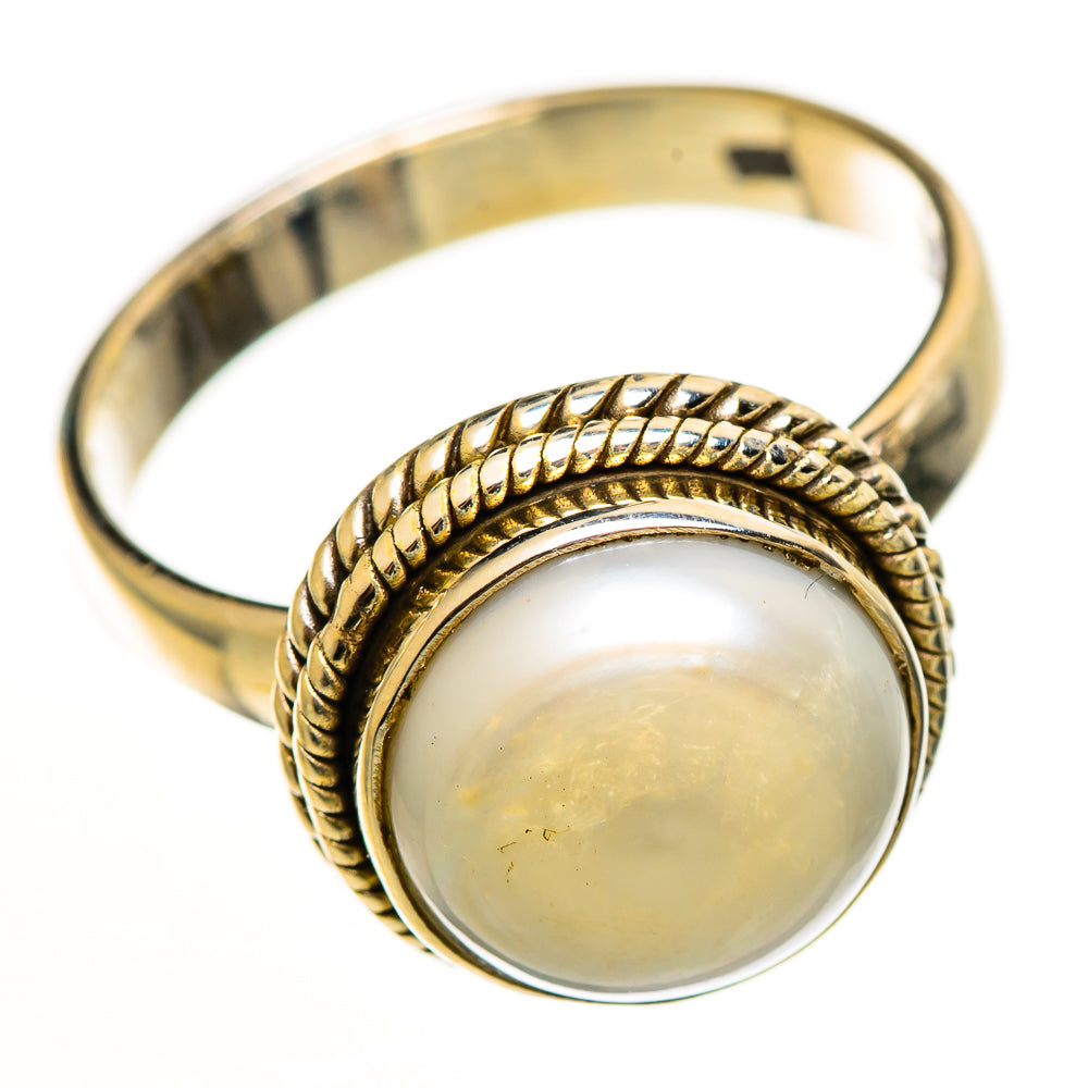 Sterling silver cultured pearl ring, round pearl set in braided rope bezel on band