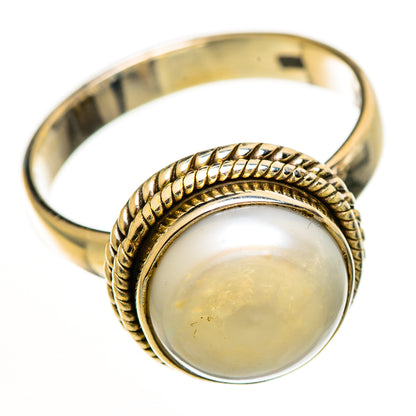 Sterling silver cultured pearl ring, round pearl set in braided rope bezel on band