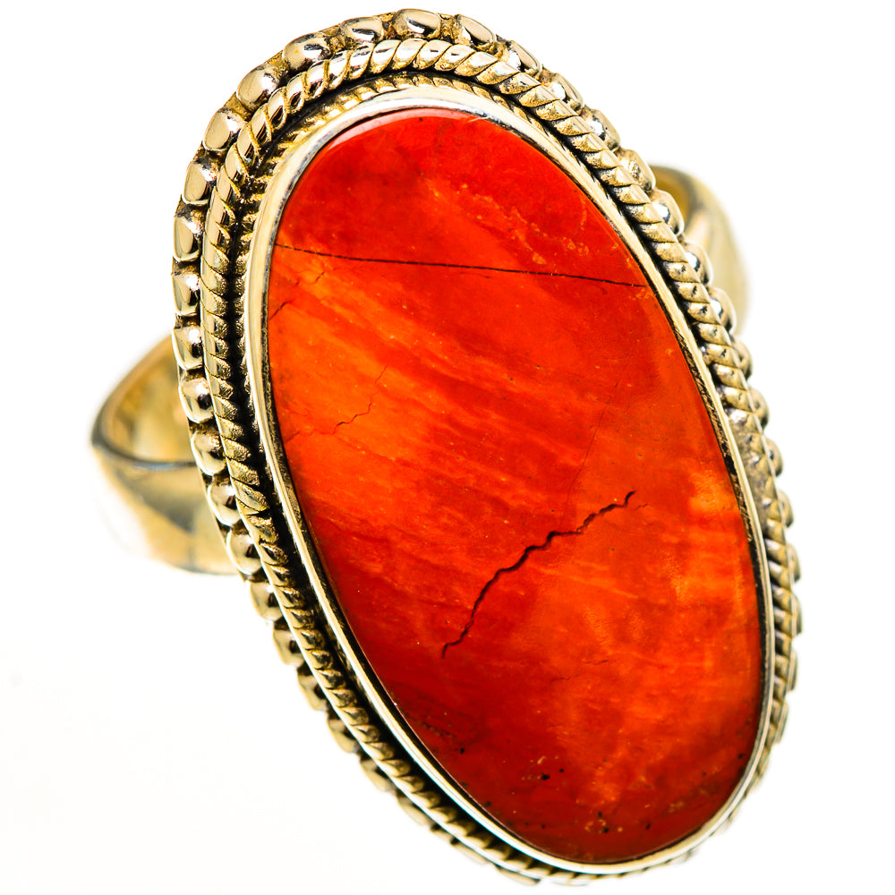 Oval red jasper gemstone ring with rope-texture bezel and gold-tone band