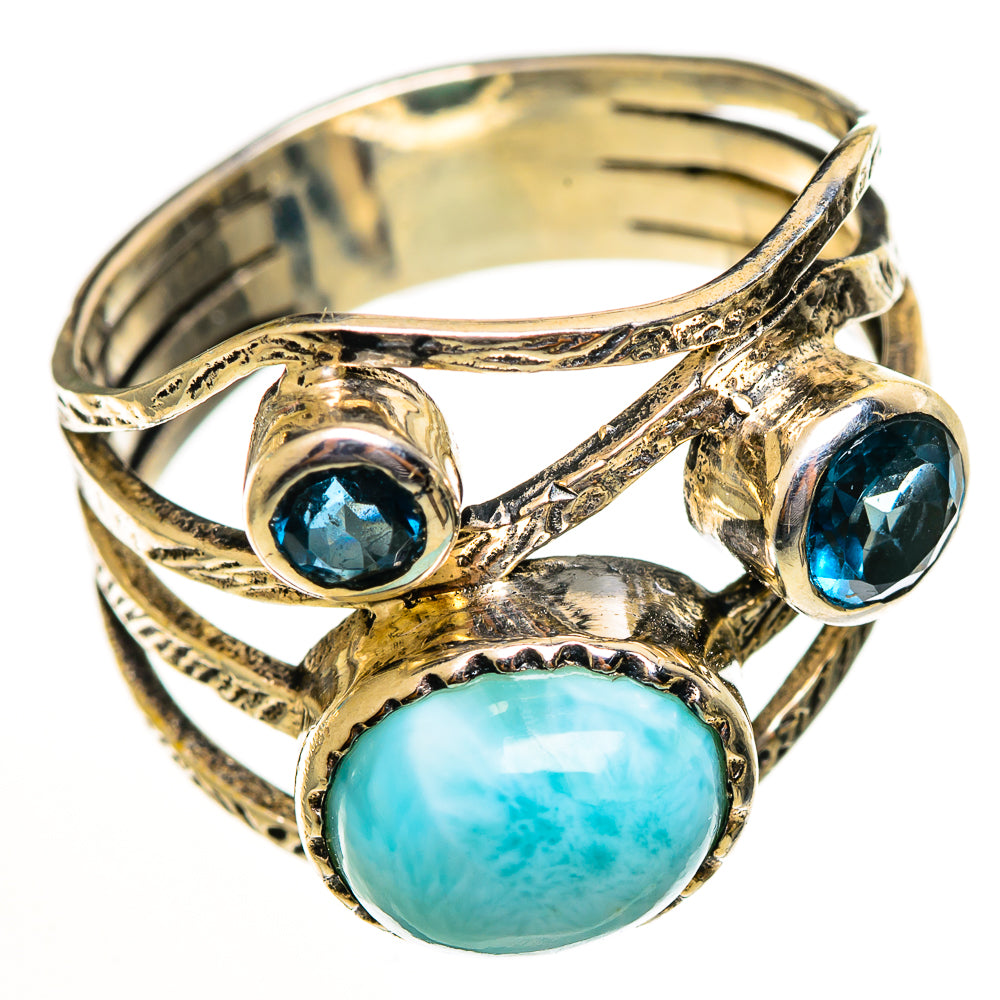 Sterling silver ring with oval larimar cabochon and two blue topaz-like stones