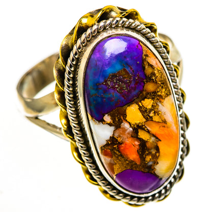Oval turquoise-style ring, purple-blue center with orange/gold matrix, rope border bezel