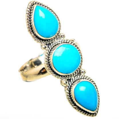 Turquoise oval gemstone ring, three-stone design with ornate silver rope bezel